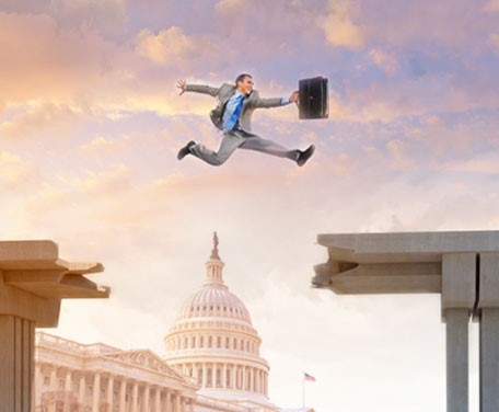 man jumping over Capitol building